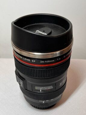 Stainless steel travel coffee mug, looks like Canon EF 24-105mm camera lens